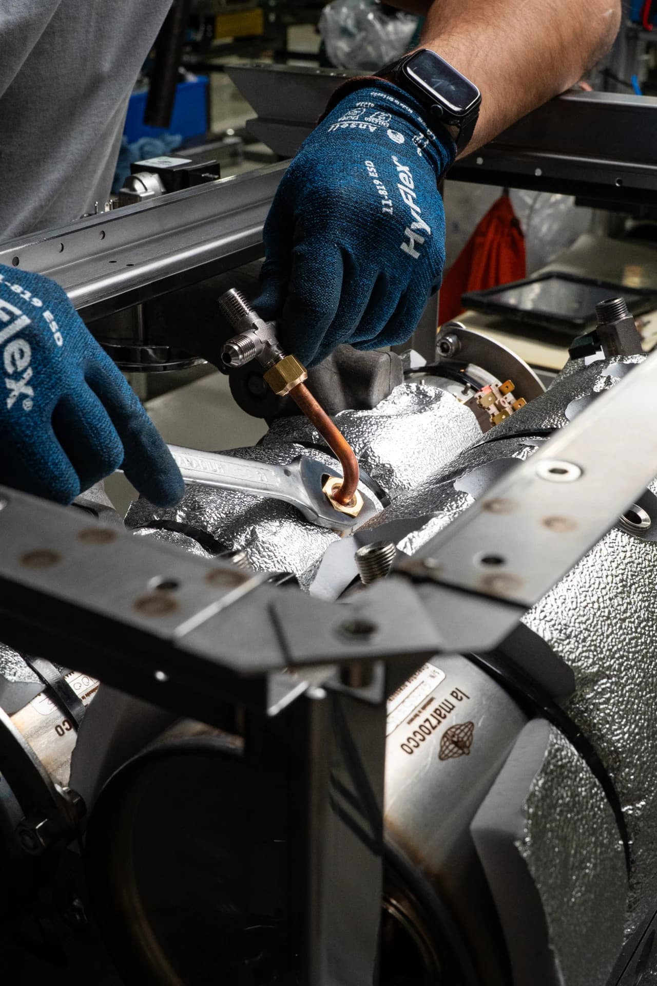 Technician assembling a mechanical component